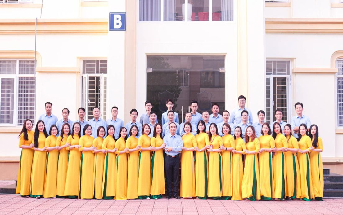 A group of people in yellow dresses

Description automatically generated